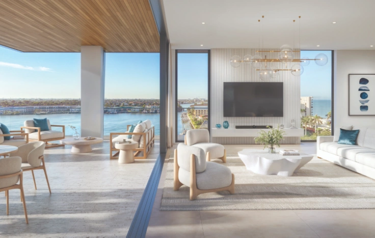 Living area opening onto a waterfront terrace.