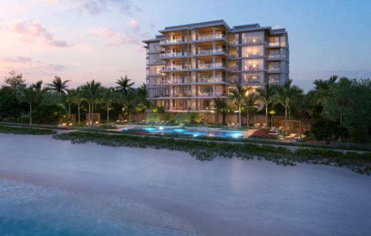 Beachfront condominium with pool and palm trees