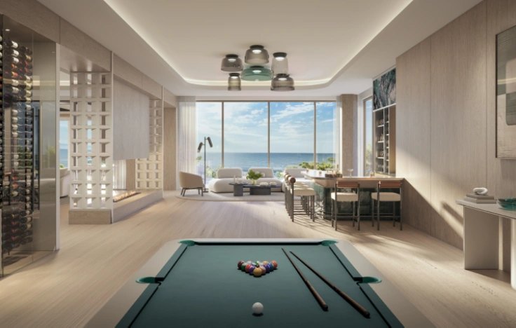 Modern clubroom with pool table and ocean-view windows